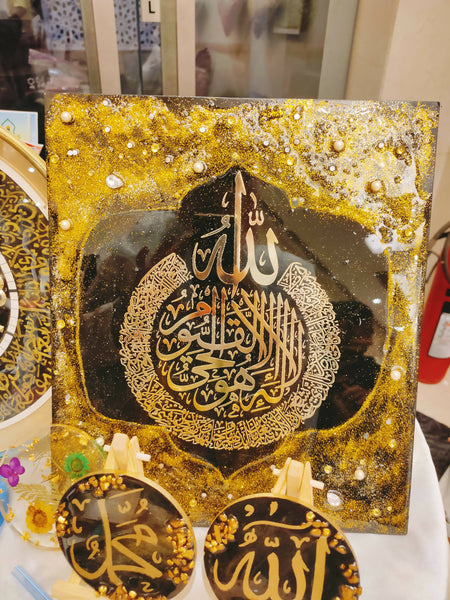 Ayatal Kursi Painting with a glossy, glass-like finish, measuring 14" x 12". The handmade painting features intricate Quranic calligraphy and can be hung as is or framed for display. Each piece is unique due to its handmade nature.