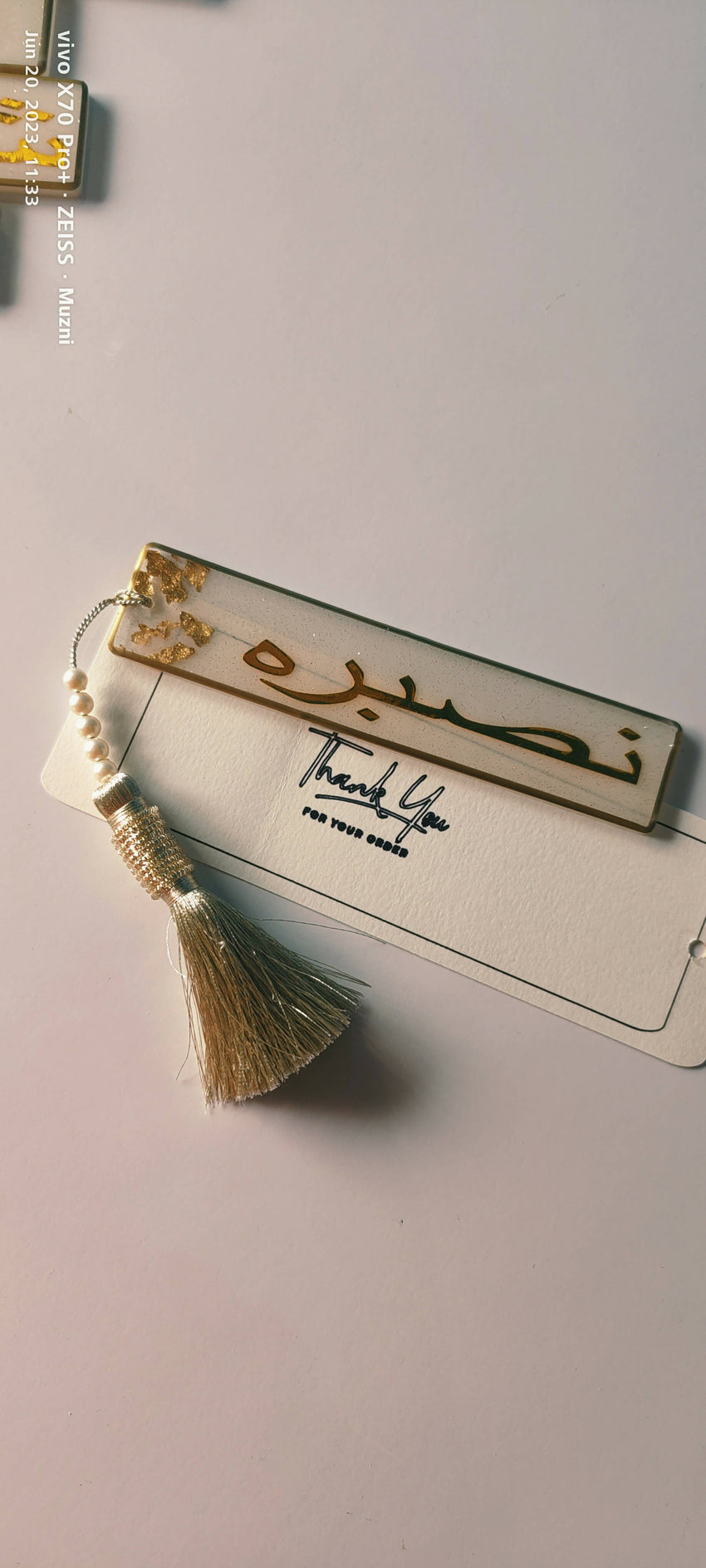 Handmade resin bookmark crafted from high-quality epoxy resin, featuring a customizable design with options for embedded flowers, colors, or glitter. The bookmark is a unique, artistic piece, ideal for marking your place in books while adding a touch of elegance and personalization to your reading experience.