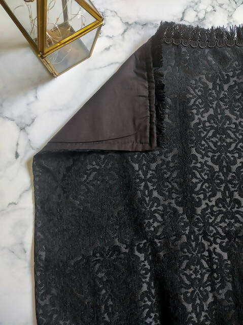 Elegant Aswad Black Luxury Prayer Mat made of high-quality Jacquard cotton, featuring intricate designs, measuring approximately 49x29 inches. This handcrafted prayer mat, made in Turkey, offers comfort and durability, making it a perfect gift for any occasion.