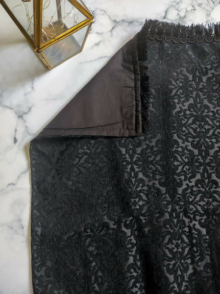 Elegant Aswad Black Luxury Prayer Mat made of high-quality Jacquard cotton, featuring intricate designs, measuring approximately 49x29 inches. This handcrafted prayer mat, made in Turkey, offers comfort and durability, making it a perfect gift for any occasion.