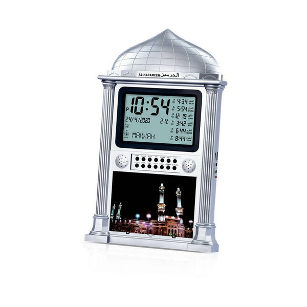Al-Harameen Azan Clock HA-4002 with a digital display showing time, date, temperature, and prayer times, featuring a dome-shaped top, built-in Qibla compass, and an image of a mosque.